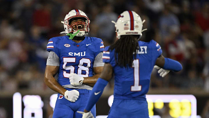 SMU defensive end Isaiah Smith, left, and safety Brandon Crossley celebrates during the first half against Pitt.