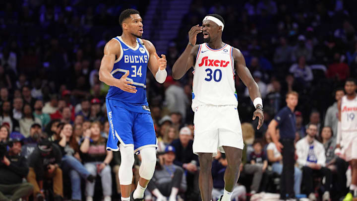 Apr 3, 2025; Philadelphia, Pennsylvania, USA; Milwaukee Bucks forward Giannis Antetokounmpo (34) and Philadelphia 76ers center Adem Bona (30) react in the second quarter at Wells Fargo Center. Mandatory Credit: Kyle Ross-Imagn Images