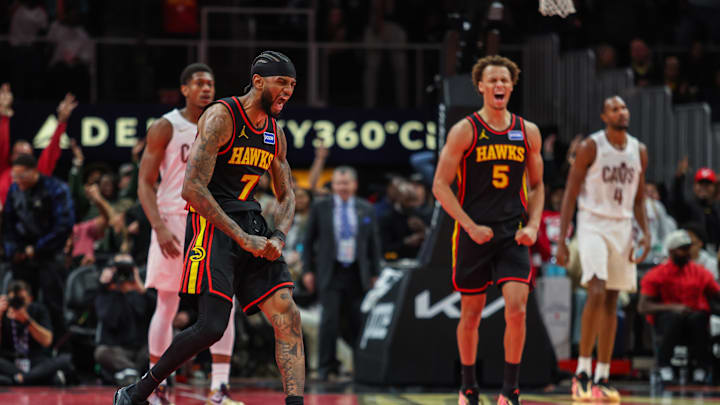 Nov 28, 2025; Atlanta, Georgia, USA; Atlanta Hawks guard Nickeil Alexander-Walker (7) and guard Dyson Daniels (5) celebrate a basket against the Cleveland Cavaliers during the fourth quarter at State Farm Arena. Mandatory Credit: Jordan Godfree-Imagn Images