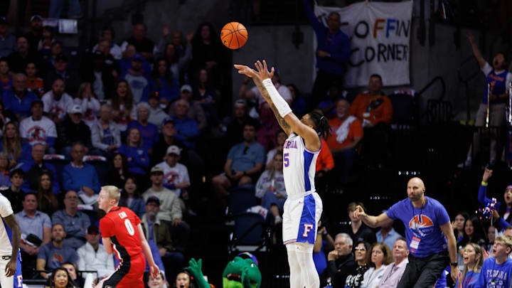 Jan 25, 2025; Gainesville, Florida, USA; Florida Gators guard Will Richard (5) makes a three point basket against the Georgia Bulldogs during the first half at Exactech Arena at the Stephen C. O'Connell Center. Mandatory Credit: Matt Pendleton-Imagn Images