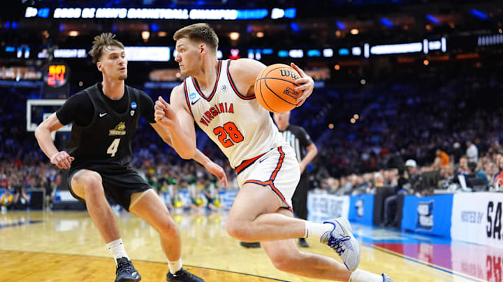 Mar 20, 2026; Philadelphia, PA, USA; Virginia Cavaliers forward Thijs de Ridder (28) drives against Wright State Raiders forward Kellen Pickett (4) during the second half during a first round game of the men's 2026 NCAA Tournament at Xfinity Mobile Arena. Mandatory Credit: Kyle Ross-Imagn Images