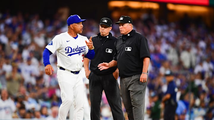 Jun 17, 2025; Los Angeles, California, USA; Los Angeles Dodgers manager Dave Roberts (30) argues with umpires during the third inning against the San Diego Padres at Dodger Stadium. Mandatory Credit: Gary A. Vasquez-Imagn Images