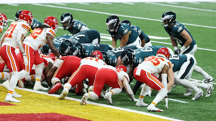 Eagles quarterback Jalen Hurts prepares to take the snap on a tush push play. 