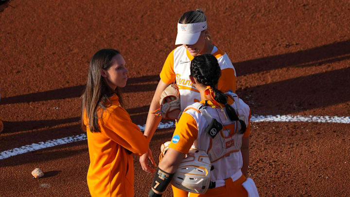 Tennessee assistant coach Megan Rhodes Smith meets with Tennessee pitcher Karlyn Pickens (23) and Tennessee catcher Sophia Nugent (7) on the pitcher's mound during an NCAA super regional game between Tennessee and Nebraska at Sherri Parker Lee Stadium in Knoxville, Tenn., on May 23, 2025.