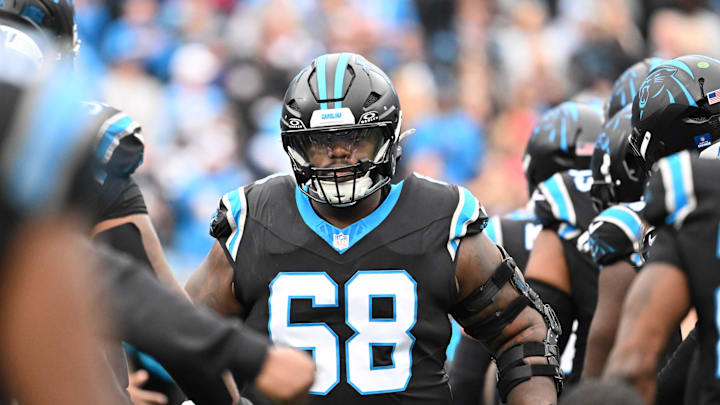 Dec 21, 2025; Charlotte, North Carolina, USA; Carolina Panthers guard Damien Lewis (68) runs on to the field before the game at Bank of America Stadium. Mandatory Credit: Bob Donnan-Imagn Images