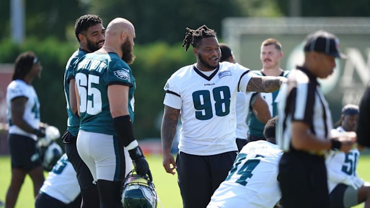 Jul 24, 2025; Philadelphia, PA, USA; Philadelphia Eagles defensive tackle Jalen Carter (98) reacts with offensive lineman Jordan Mailata (68) and offensive lineman Lane Johnson (65) during training camp at NovaCare Complex. Mandatory Credit: Kyle Ross-Imagn Images Jul 24, 2025; Philadelphia, PA, USA; Philadelphia Eagles defensive tackle Jalen Carter (98) reacts with offensive lineman Jordan Mailata (68) and offensive lineman Lane Johnson (65) during training camp at NovaCare Complex. Mandatory Credit: Kyle Ross-Imagn Images