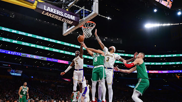 Dec 25, 2023; Los Angeles, California, USA; Boston Celtics guard Derrick White (9) moves to the basket against Los Angeles Lakers forward Jarred Vanderbilt (2) and forward Anthony Davis (3) during the second half at Crypto.com Arena. Mandatory Credit: Gary A. Vasquez-Imagn Images Dec 25, 2023; Los Angeles, California, USA; Boston Celtics guard Derrick White (9) moves to the basket against Los Angeles Lakers forward Jarred Vanderbilt (2) and forward Anthony Davis (3) during the second half at Crypto.com Arena. Mandatory Credit: Gary A. Vasquez-Imagn Images