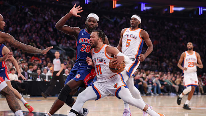 Dec 7, 2024; New York, New York, USA; New York Knicks guard Jalen Brunson (11) drives to the basket as Detroit Pistons center Isaiah Stewart (28) defends during the second half at Madison Square Garden. Mandatory Credit: Vincent Carchietta-Imagn Images