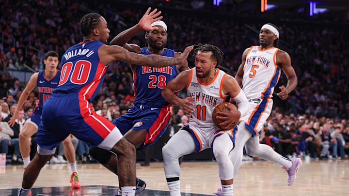 Dec 7, 2024; New York, New York, USA; New York Knicks guard Jalen Brunson (11) drives to the basket as Detroit Pistons center Isaiah Stewart (28) and forward Ronald Holland II (00) defend during the second half at Madison Square Garden. Mandatory Credit: Vincent Carchietta-Imagn Images