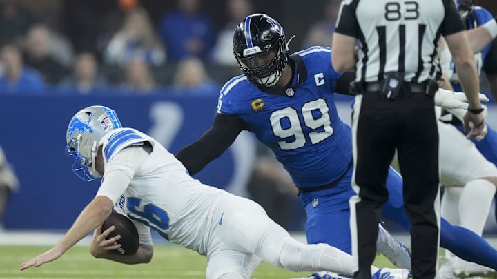 Nov 24, 2024; Indianapolis, Indiana, USA; Indianapolis Colts defensive tackle DeForest Buckner (990 moves in on Detroit Lions quarterback Jared Goff (16) during a game at Lucas Oil Stadium.  