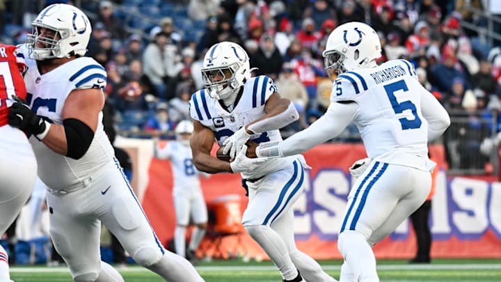 Dec 1, 2024; Foxborough, Massachusetts, USA; Indianapolis Colts quarterback Anthony Richardson (5) hands the ball off to running back Jonathan Taylor (28) during the second half at Gillette Stadium. Dec 1, 2024; Foxborough, Massachusetts, USA; Indianapolis Colts quarterback Anthony Richardson (5) hands the ball off to running back Jonathan Taylor (28) during the second half at Gillette Stadium.