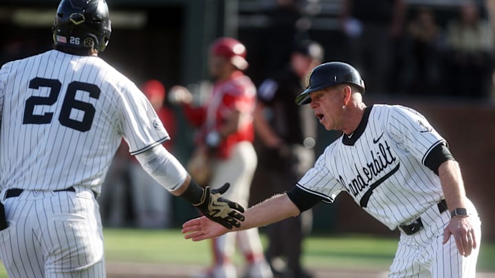 Vanderbilt baseball head coach Tim Corbin congratulates Vanderbilt's Braden Holcomb (26) on a home run during their game against Marist at Vanderbilt’s Hawkins Field Friday, Feb. 20, 2026.