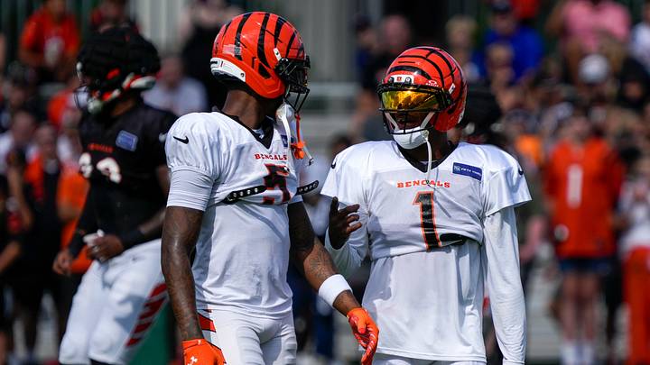 Cincinnati Bengals wide receiver Tee Higgins (5) and wide receiver Ja'marr Chase (1) chat during practice at the Paycor Stadium practice facility in downtown Cincinnati on Monday, Aug. 3, 2026. Cincinnati Bengals wide receiver Tee Higgins (5) and wide receiver Ja'marr Chase (1) chat during practice at the Paycor Stadium practice facility in downtown Cincinnati on Monday, Aug. 3, 2026.