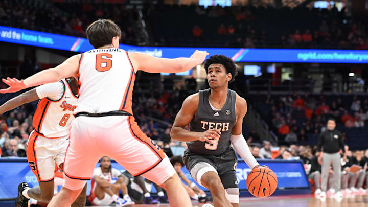 Jan 7, 2025; Syracuse, New York, USA; Georgia Tech Yellow Jackets guard Jaeden Mustaf (3) looks to the basket as Syracuse Orange forward Petar Majstorovic (6) defends in the first half at the JMA Wireless Dome. Mandatory Credit: Mark Konezny-Imagn Images