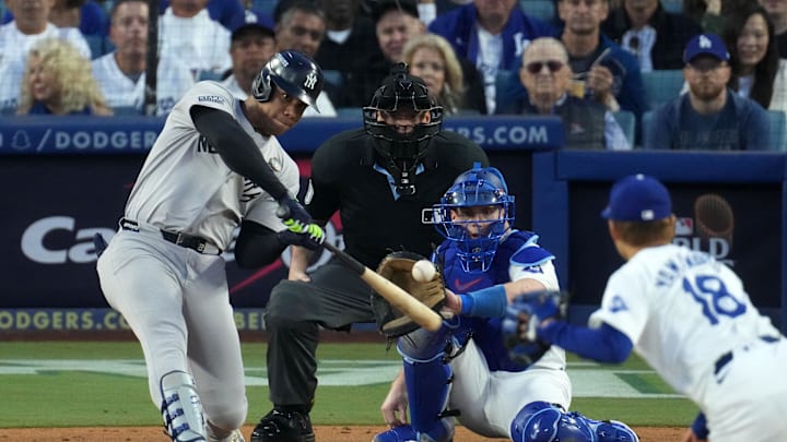 New York Yankees outfielder Juan Soto (22) hits a home run against the Los Angeles Dodgers pitcher Yoshinobu Yamamoto (18) in the third inning for game two of the 2024 MLB World Series at Dodger Stadium on Oct 26. New York Yankees outfielder Juan Soto (22) hits a home run against the Los Angeles Dodgers pitcher Yoshinobu Yamamoto (18) in the third inning for game two of the 2024 MLB World Series at Dodger Stadium on Oct 26.