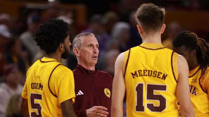 Jan 10, 2026; Tempe, Arizona, USA; Arizona State Sun Devils head coach Bobby Hurley in the huddle with his players against the Kansas State Wildcats in the first half at Desert Financial Arena. Mandatory Credit: Mark J. Rebilas-Imagn Images