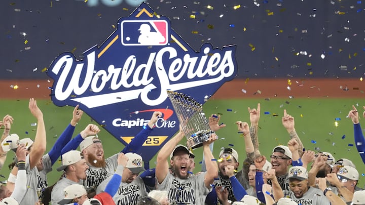 Nov 1, 2025; Toronto, Ontario, CAN; Los Angeles Dodgers pitcher Clayton Kershaw (22) celebrates with the Commissioner's Trophy after defeating the Toronto Blue Jays in game seven of the 2025 MLB World Series at Rogers Centre. Mandatory Credit: Kevin Sousa-Imagn Images Nov 1, 2025; Toronto, Ontario, CAN; Los Angeles Dodgers pitcher Clayton Kershaw (22) celebrates with the Commissioner's Trophy after defeating the Toronto Blue Jays in game seven of the 2025 MLB World Series at Rogers Centre. Mandatory Credit: Kevin Sousa-Imagn Images