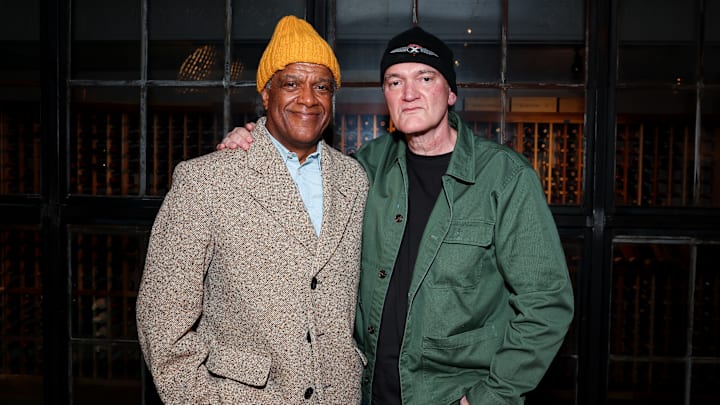 Elvis Mitchell and Quentin Tarantino. Credit: Shutterstock / Chelsea Lauren for The Elvis Mitchell Suite presented by Darling&Co