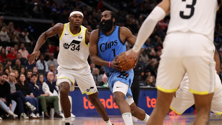 Feb 8, 2025; Inglewood, California, USA;  Los Angeles Clippers guard James Harden (1) drives to the basket against Utah Jazz center Oscar Tshiebwe (34) during the third quarter at Intuit Dome. Mandatory Credit: Kiyoshi Mio-Imagn Images