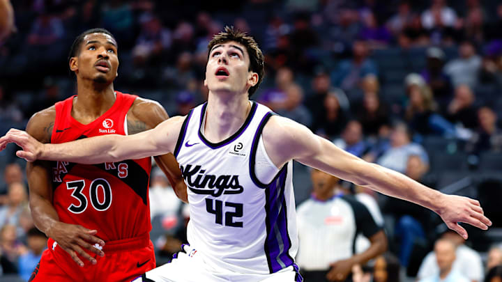 Oct 8, 2025; Sacramento, California, USA; Sacramento Kings center Maxime Raynaud (42) positions for a rebound against Toronto Raptors guard Ochai Agbaji (30) during the fourth quarter at Golden 1 Center. Mandatory Credit: Sergio Estrada-Imagn Images