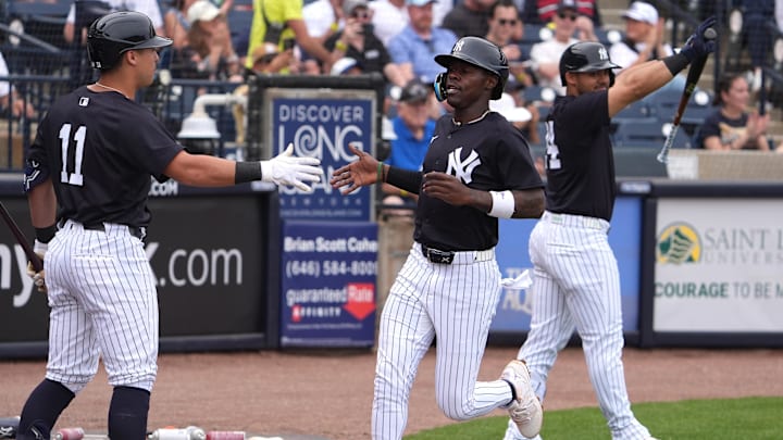 New York Yankees third base Jazz Chisholm Jr. is congratulated by shortstop Anthony Volpe.