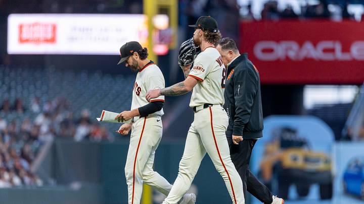 San Francisco Giants pitcher Carson Whisenhunt being removed | Credit: Bob Kupbens