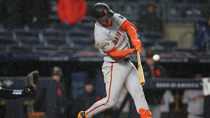 Apr 11, 2025; Bronx, New York, USA; San Francisco Giants catcher Patrick Bailey (14) hits an RBI double during the fifth inning against the New York Yankees at Yankee Stadium. 