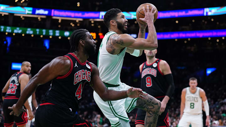 Dec 19, 2024; Boston, Massachusetts, USA; Boston Celtics forward Jayson Tatum (0) drives the ball to the basket against Chicago Bulls forward Patrick Williams (44) in the second quarter at TD Garden. Mandatory Credit: David Butler II-Imagn Images Dec 19, 2024; Boston, Massachusetts, USA; Boston Celtics forward Jayson Tatum (0) drives the ball to the basket against Chicago Bulls forward Patrick Williams (44) in the second quarter at TD Garden. Mandatory Credit: David Butler II-Imagn Images