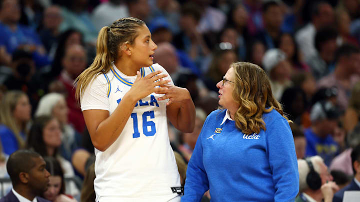 Apr 5, 2026; Phoenix, AZ, USA; UCLA Bruins forward Sienna Betts (16) with head coach Cori Close against the South Carolina Gamecocks during the National Championship game of the women's 2026 NCAA Tournament at Mortgage Matchup Center. Mandatory Credit: Mark J. Rebilas-Imagn Images