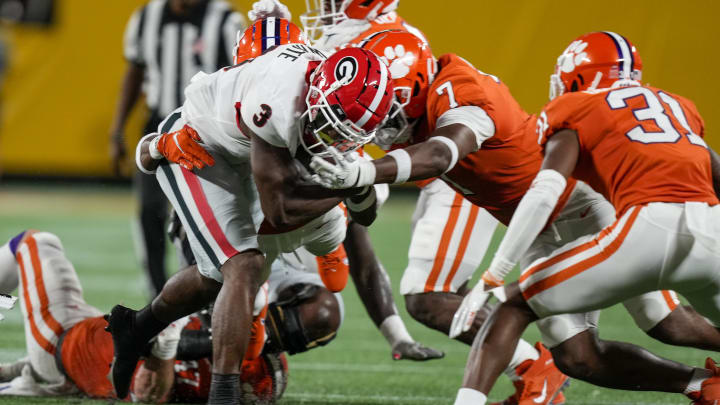 Sep 4, 2021; Charlotte, North Carolina, USA; Georgia Bulldogs running back Zamir White (3) is stopped by Clemson Tigers defensive end Justin Mascoll (7) during the first quarter at Bank of America Stadium. Mandatory Credit: Jim Dedmon-USA TODAY Sports
