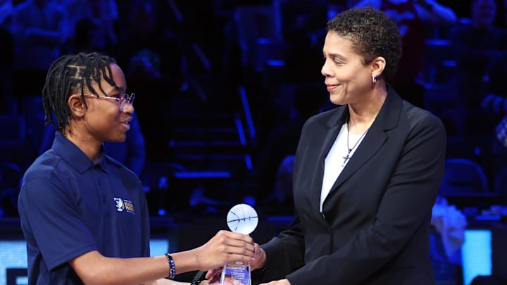 Jan 20, 2025; Memphis, Tennessee, USA; Former basketball Olympian Cheryl Miller receives the Sports Legacy Award prior to the game between the Minnesota Timberwolves and the Memphis Grizzlies at FedExForum. Mandatory Credit: Petre Thomas-Imagn Images
