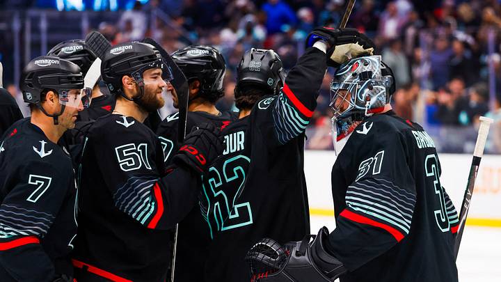 Oct 20, 2026; Seattle, Washington, USA; Seattle Kraken goaltender Philipp Grubauer (31) celebrates an overtime shootout victory against the Detroit Red Wings with right wing Jordan Eberle (7), center Shane Wright (51) and defenseman Brandon Montour (62) at Climate Pledge Arena. Mandatory Credit: Joe Nicholson-Imagn Images