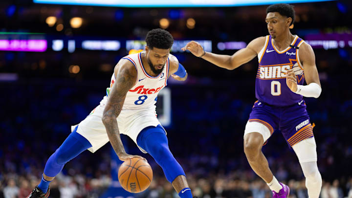 Jan 6, 2025; Philadelphia, Pennsylvania, USA; Philadelphia 76ers forward Paul George (8) controls the ball against Phoenix Suns forward Ryan Dunn (0) during the first quarter at Wells Fargo Center. Mandatory Credit: Bill Streicher-Imagn Images