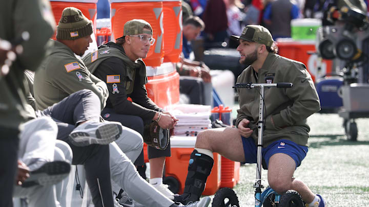 Nov 16, 2025; East Rutherford, New Jersey, USA; New York Giants quarterback Jaxson Dart (6) and running back Cam Skattebo, right, talk before the game against the Green Bay Packers at MetLife Stadium.  