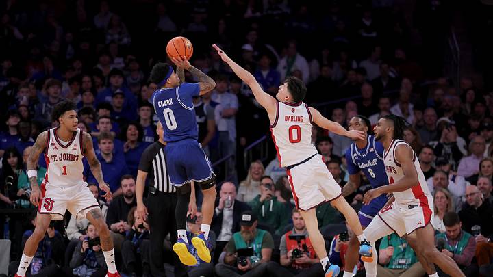 Mar 13, 2026; New York, NY, USA; Seton Hall Pirates guard Adam Clark (0) takes a shot against St. John's Red Storm guard Dylan Darling (0) during the second half at Madison Square Garden. Mandatory Credit: Brad Penner-Imagn Images Mar 13, 2026; New York, NY, USA; Seton Hall Pirates guard Adam Clark (0) takes a shot against St. John's Red Storm guard Dylan Darling (0) during the second half at Madison Square Garden. Mandatory Credit: Brad Penner-Imagn Images