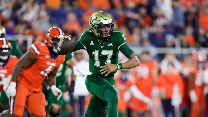 Dec 21, 2023; Boca Raton, FL, USA; South Florida Bulls quarterback Byrum Brown (17) drops back to pass against the Syracuse Orange in the first quarter during the RoofClaim.com Boca Raton Bowl at FAU Stadium. Mandatory Credit: Nathan Ray Seebeck-USA TODAY Sports