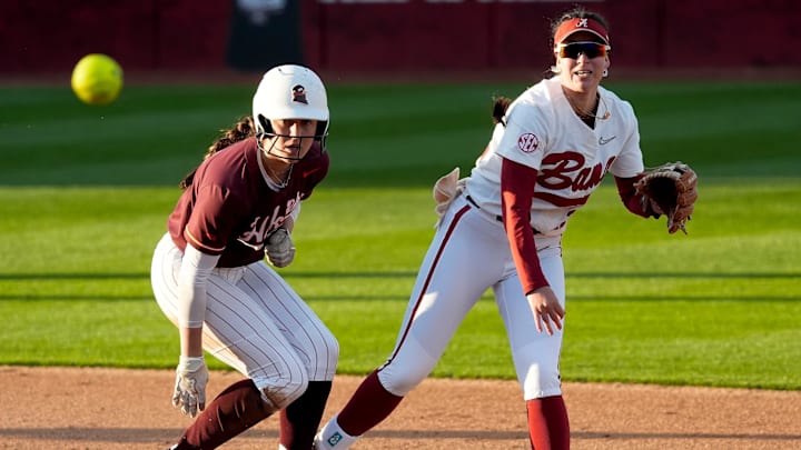 Feb 21, 2025; Tuscaloosa, Alabama, USA; Alabama second baseman Kali Heivilin attempts to turn a double play after forcing Virginiat Tech runner Bre Peck at second during the Easton Bama Bash at Rhoads Stadium Friday in the home opener for the Crimson Tide.