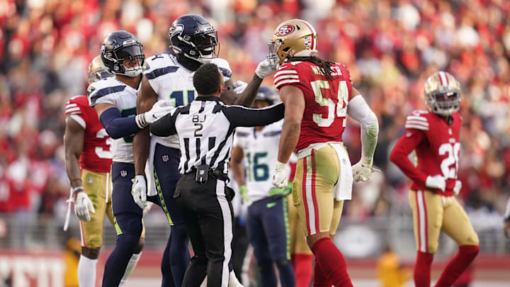 Dec 10, 2023; Santa Clara, California, USA; Seattle Seahawks wide receiver DK Metcalf (14) grabs the face mask of San Francisco 49ers linebacker Fred Warner (54) after the end of play in the fourth quarter at Levi's Stadium. Mandatory Credit: Cary Edmondson-Imagn Images Dec 10, 2023; Santa Clara, California, USA; Seattle Seahawks wide receiver DK Metcalf (14) grabs the face mask of San Francisco 49ers linebacker Fred Warner (54) after the end of play in the fourth quarter at Levi's Stadium. Mandatory Credit: Cary Edmondson-Imagn Images