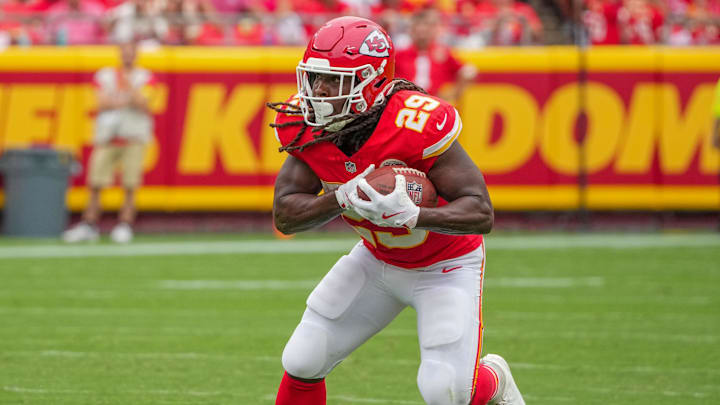 Sep 14, 2025; Kansas City, Missouri, USA; Kansas City Chiefs running back Kareem Hunt (29) runs the ball against the Philadelphia Eagles during the game at GEHA Field at Arrowhead Stadium. Mandatory Credit: Denny Medley-Imagn Images