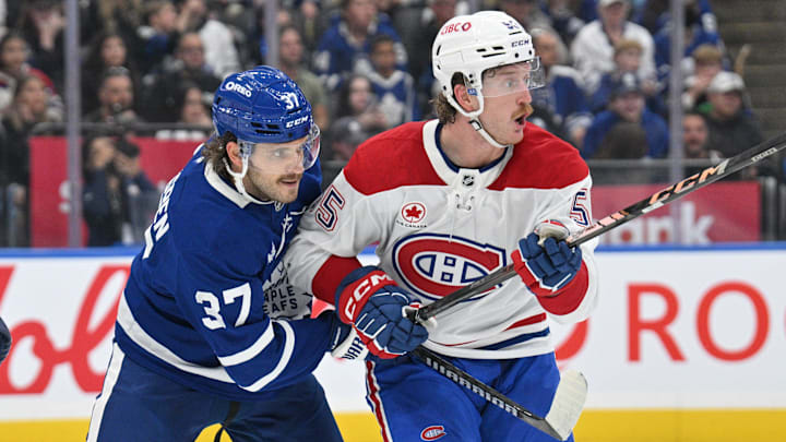 Sep 26, 2024; Toronto, Ontario, CAN;  Toronto Maple Leafs defenseman Timothy Liljegren (37) covers Montreal Canadiens forward Michael Pezzetta (55) in the third period at Scotiabank Arena. Mandatory Credit: Dan Hamilton-Imagn Images