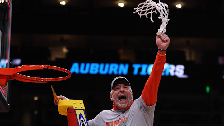 Mar 30, 2025; Atlanta, GA, USA; Auburn Tigers head coach Bruce Pearl cuts down the net after winning the South Regional final of the 2025 NCAA tournament against the Michigan State Spartans at State Farm Arena. Mandatory Credit: Brett Davis-Imagn Images
