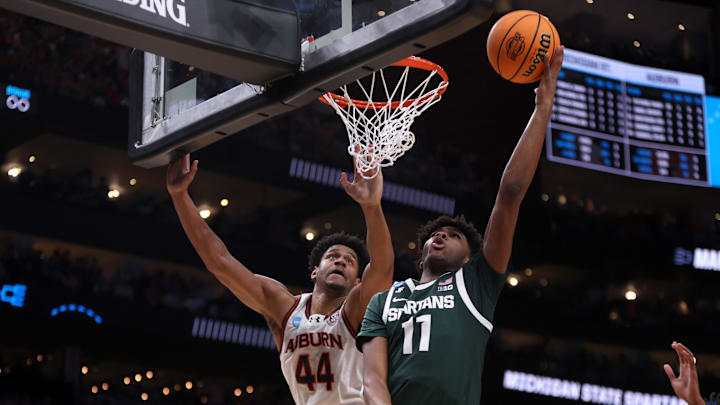 Mar 30, 2025; Atlanta, GA, USA; Michigan State Spartans guard Jase Richardson (11) shoots against Auburn Tigers center Dylan Cardwell (44) during the second half in the South Regional final of the 2025 NCAA tournament at State Farm Arena. Mandatory Credit: Brett Davis-Imagn Images