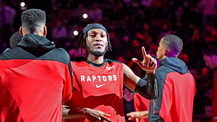 Apr 4, 2025; Toronto, Ontario, CAN;  Toronto Raptors guard Immanuel Quickley (5) is greeted by team mates during player introductions before tip off against the Detroit Pistons at Scotiabank Arena. Mandatory Credit: Dan Hamilton-Imagn Images
