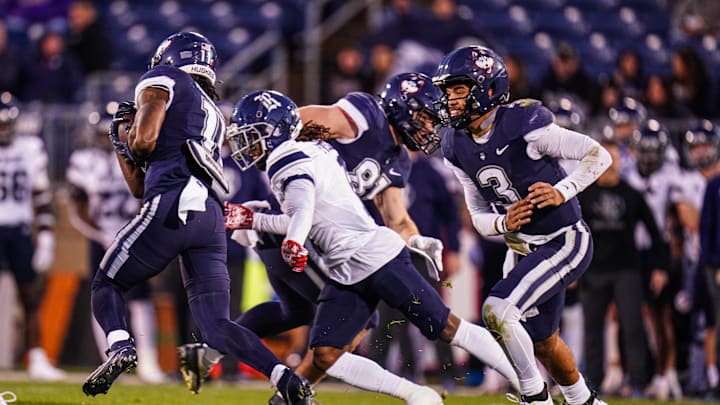 Oct 26, 2024; East Hartford, Connecticut, USA; Connecticut Huskies running back Durell Robinson (11) runs the ball for a touchdown against the Rice Owls in the second half at Rentschler Field at Pratt & Whitney Stadium. Mandatory Credit: David Butler II-Imagn Images