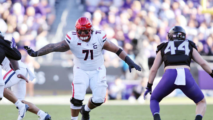  Arizona Wildcats offensive lineman Jonah Savaiinaea (71) blocks in the second quarter against the TCU Horned Frogs at Amon G. Carter Stadium. 