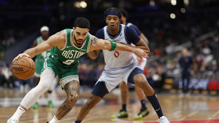 Dec 15, 2024; Washington, District of Columbia, USA; Boston Celtics forward Jayson Tatum (0) dribbles the ball as Washington Wizards guard Bilal Coulibaly (0) defends in the second quarter at Capital One Arena. Mandatory Credit: Geoff Burke-Imagn Images