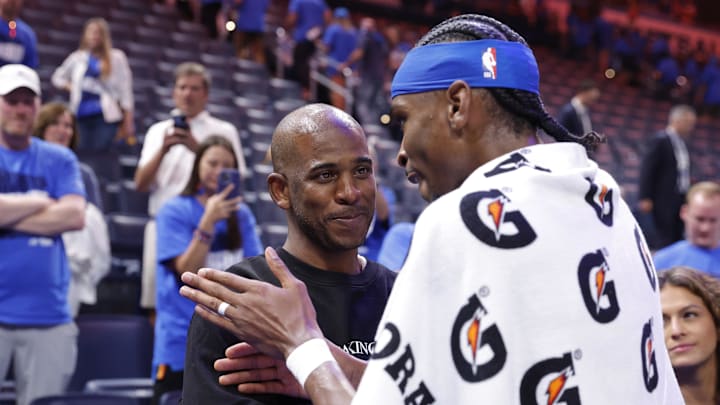 May 22, 2025; Oklahoma City, Oklahoma, USA; Oklahoma City Thunder guard Shai Gilgeous-Alexander (2) talks to Chris Paul after defeating the Minnesota Timberwolves during game two of the western conference finals for the 2025 NBA Playoffs at Paycom Center. Mandatory Credit: Alonzo Adams-Imagn Images