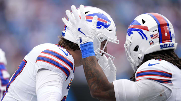 Buffalo Bills running back James Cook III (4) celebrates with quarterback Josh Allen (17) after scoring a touchdown during the second half against the Carolina Panthers at Bank of America Stadium. Buffalo Bills running back James Cook III (4) celebrates with quarterback Josh Allen (17) after scoring a touchdown during the second half against the Carolina Panthers at Bank of America Stadium.