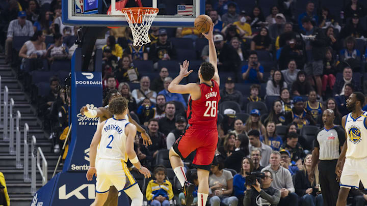 Dec 5, 2024; San Francisco, California, USA;  Golden State Warriors guard Brandin Podziemski (2) watches as Houston Rockets center Alperen Sengun (28) shoots during the first quarter at Chase Center. Mandatory Credit: John Hefti-Imagn Images