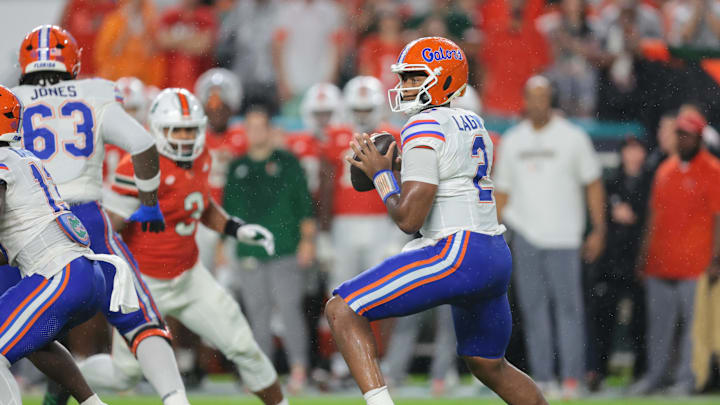 Sep 20, 2025; Miami Gardens, Florida, USA; Florida Gators quarterback DJ Lagway (2) looks for a passing option against the Miami Hurricanes during the first quarter at Hard Rock Stadium. Mandatory Credit: Sam Navarro-Imagn Images